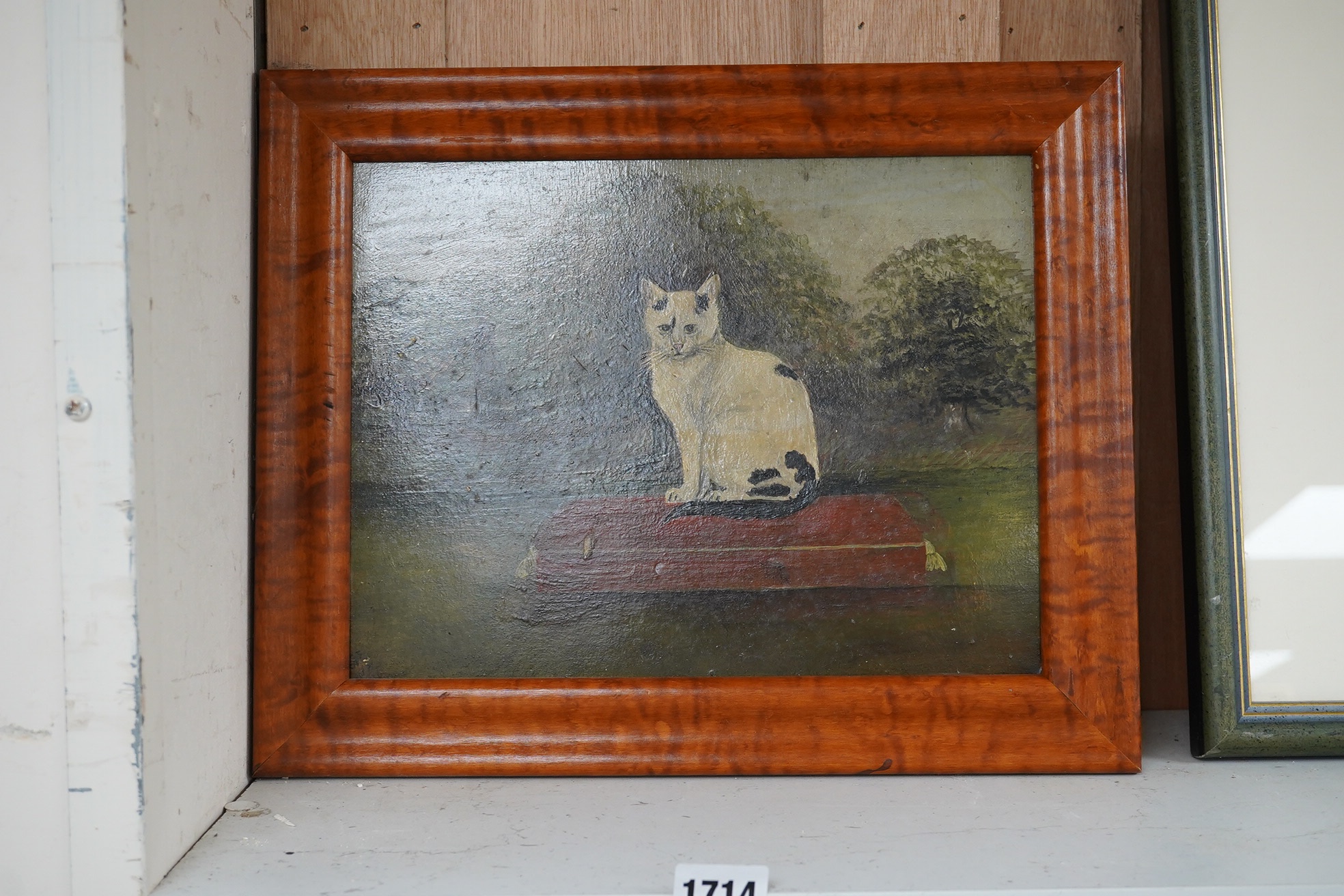 Late 19th / early 20th century, naive English School, oil on board, Study of a seated cat, indistinctly monogrammed lower left, 22 x 29cm. Condition - fair